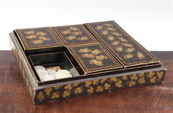 A Chinese export lacquer games box and mother-of-pearl counters, 19th century, box 29cm